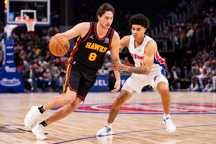 Mar 7, 2022; Detroit, Michigan, USA; Atlanta Hawks forward Danilo Gallinari (8) gets defended by Detroit Pistons guard Killian Hayes (7) during the first quarter at Little Caesars Arena.